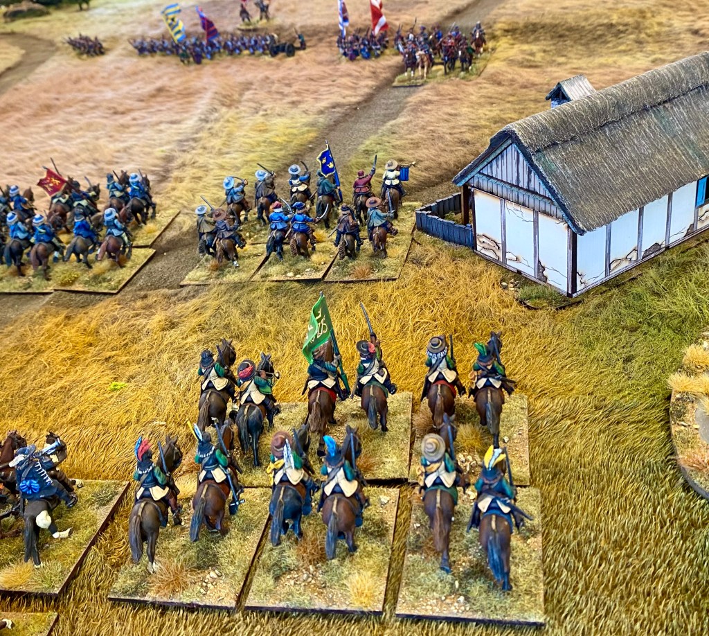 A strong brigade of Swedish horse sweep on to the board and prepare to smash through the Poles ahead of them. 