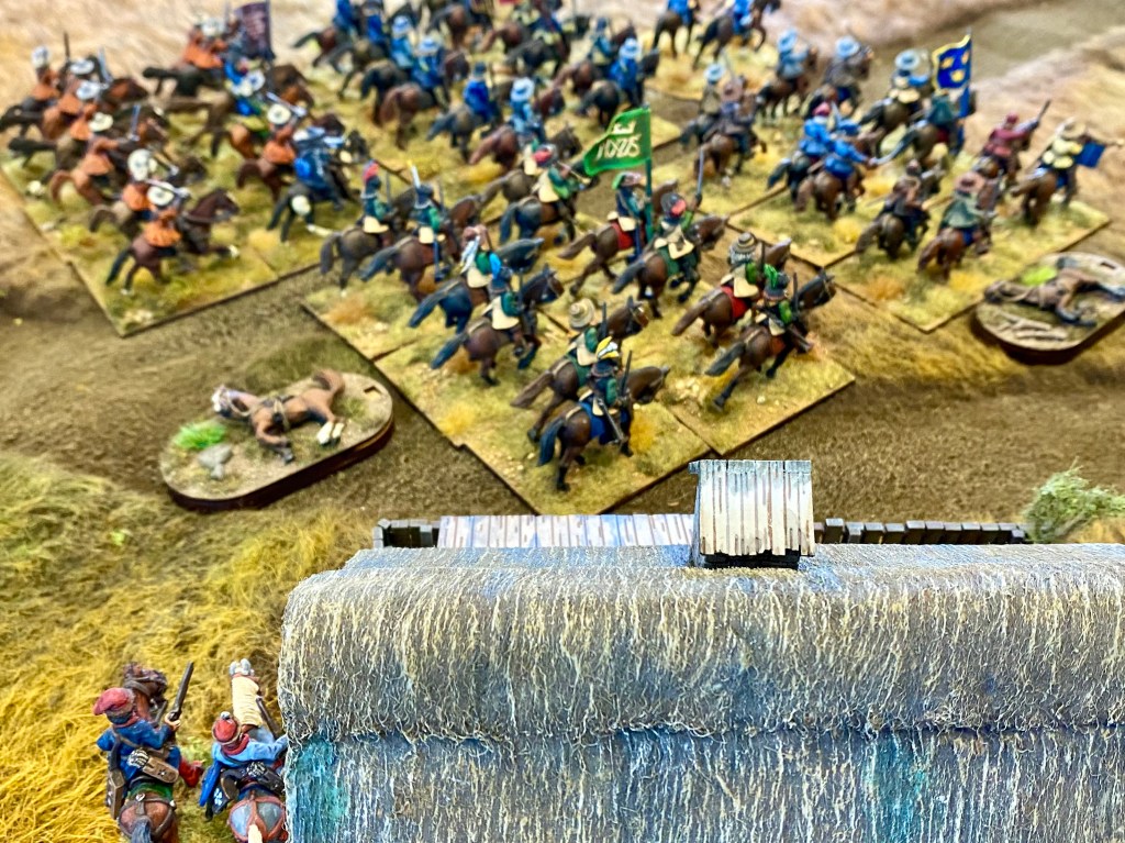 The Swedish horse, who were preparing for a heroic charge in to the Poles ahead of them, suddenly find that they are needed in the rear, and what's this? More Poles appearing from the village in the rear?!