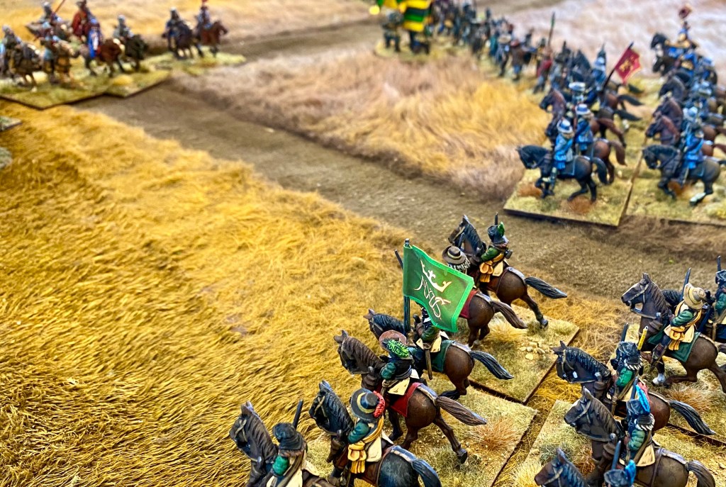 Having beaten off the ambush from the village, the Swedish horse turn to see off the Polish cossacks who have looted the wagons. 