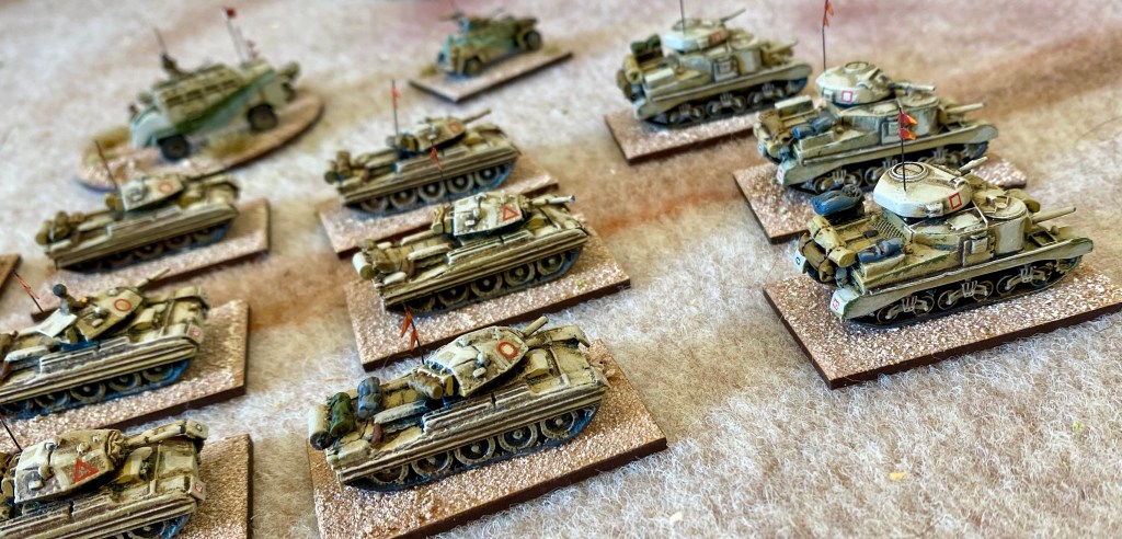 A mixed formation of Crusaders and Grants speeds through the desert