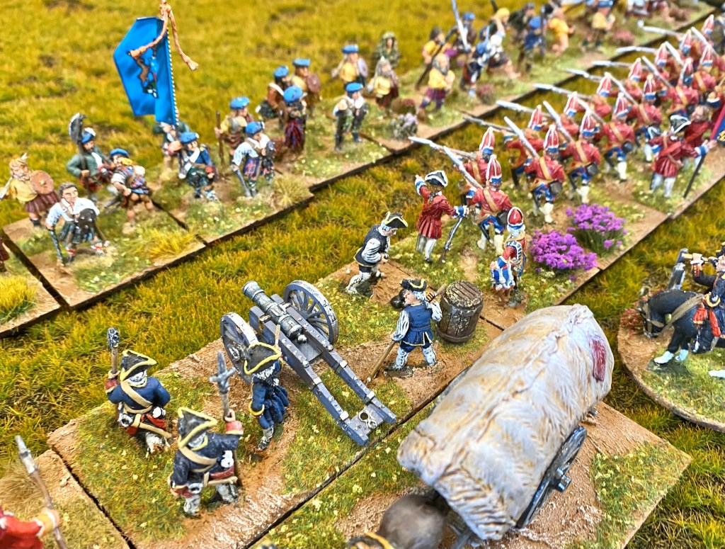 The first charge is stopped just before making it to the line of waiting red coats.