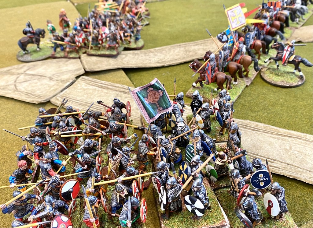 Crunch! Armoured shield walls clash.
