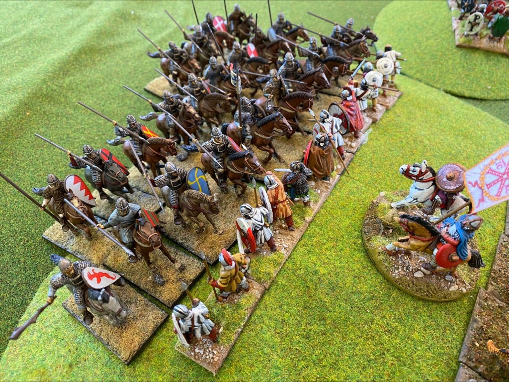 The Breton foot managed to survive the first round of combat but are already down to a single rank of figures. 